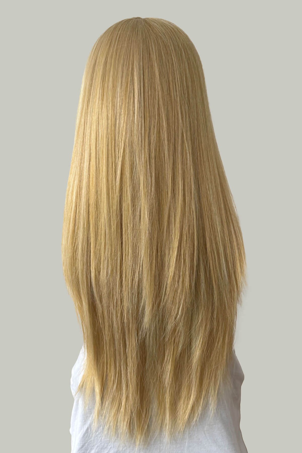 Blonde wig on a mannequin head against a plain background. Annabelle's Wigs synthetic wig Straight blonde half wig hairpiece (3/4 wig) blonde: Tabitha blonde 24B613