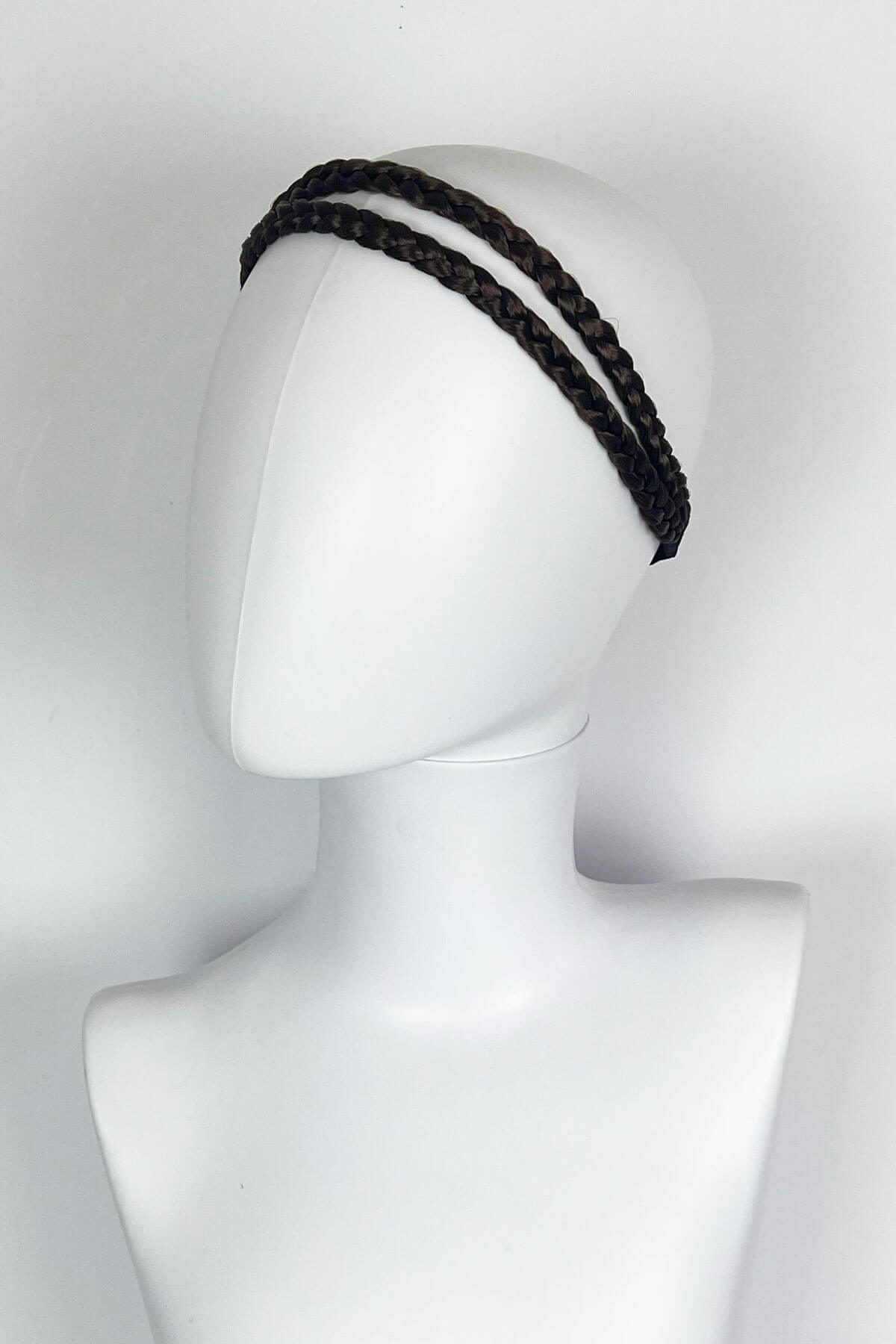 Black braided headband on a mannequin head against a white background. Plaited double hairband: Mira : chestnut brown 8