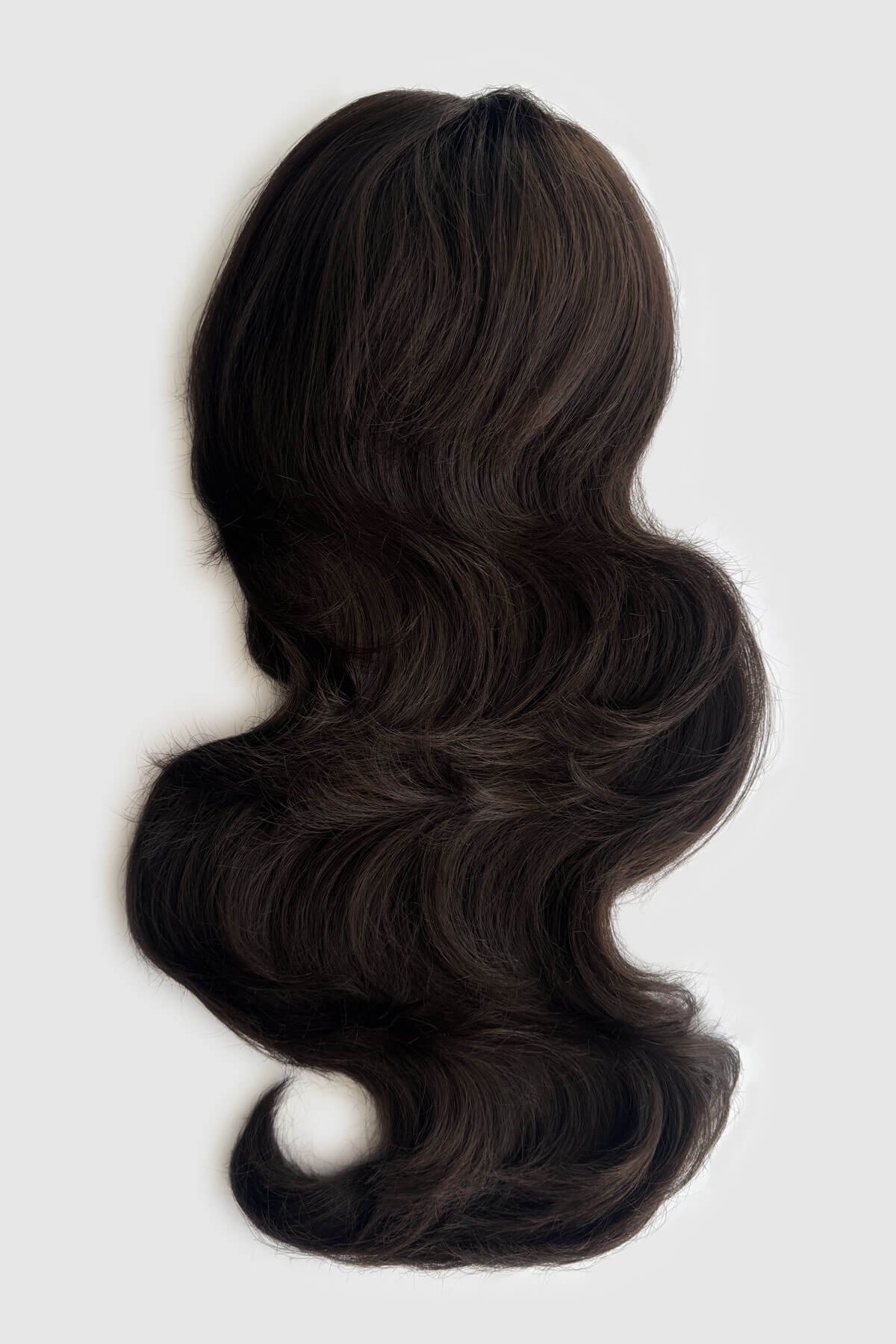 A long, wavy hair piece in a dark brown colour, against a light grey background. Double volume hairpiece extension: Naomi dark brown 4