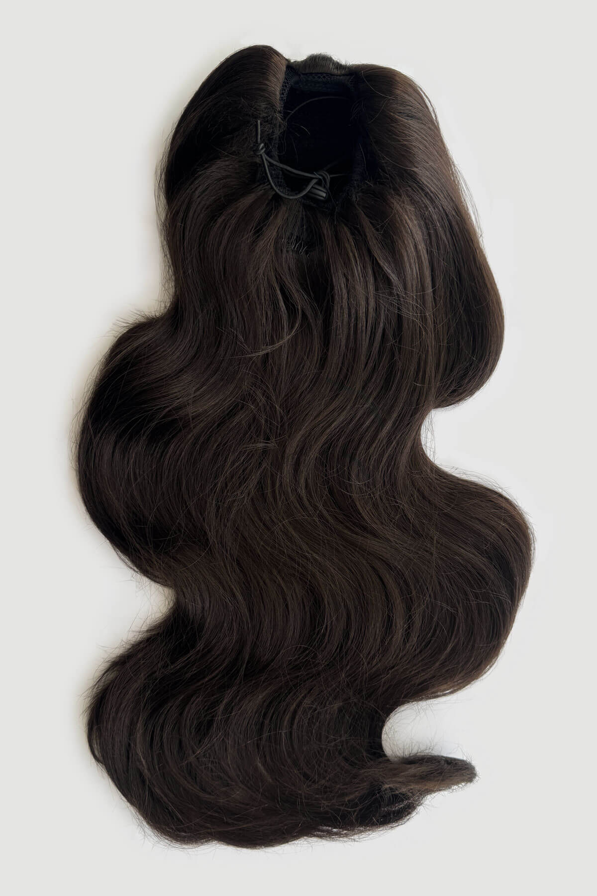 A dark brown wavy hair extension or wig draw string attachment shown from the back against a light grey background. Double volume hairpiece extension: Naomi dark brown 4