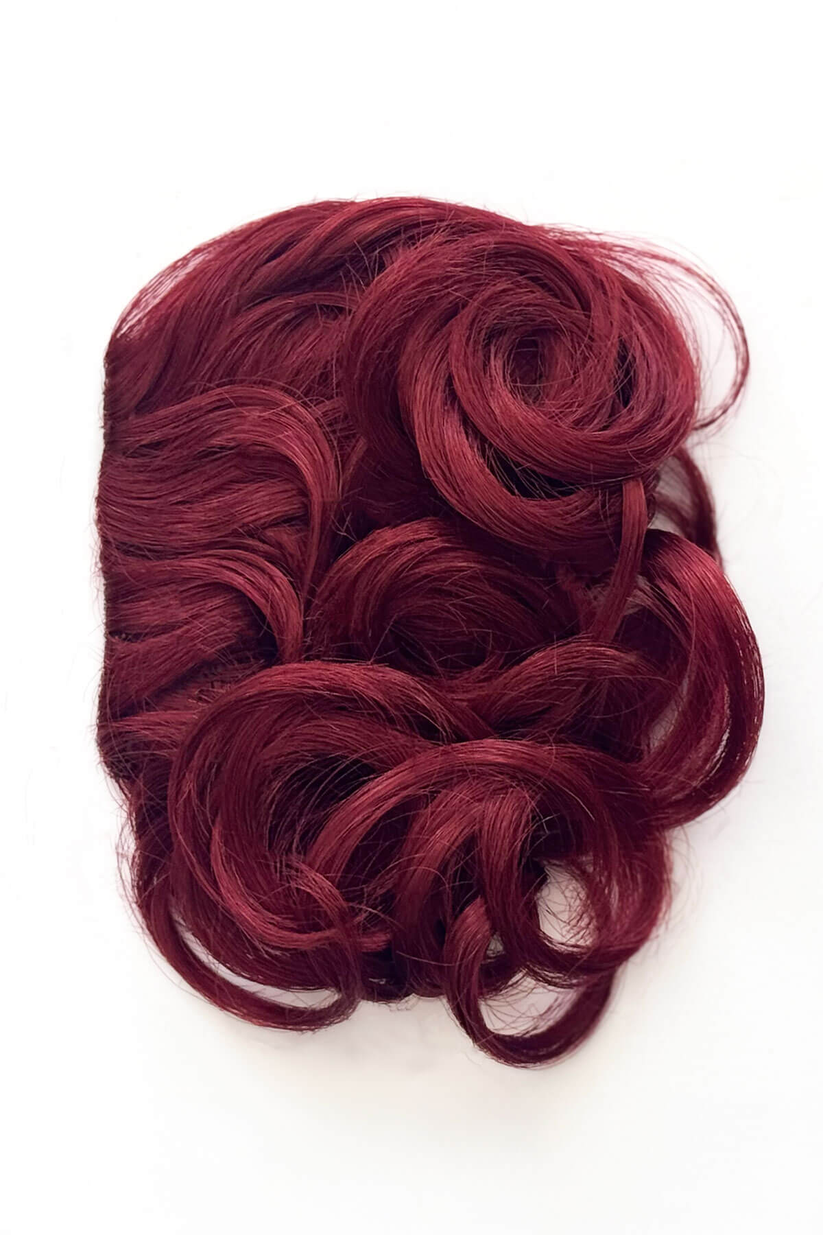 Red hairpiece with wavy texture on a white background. Curly 1940s style clip-in fringe hairpiece/clip-in bangs: Bunny cherry red 39
