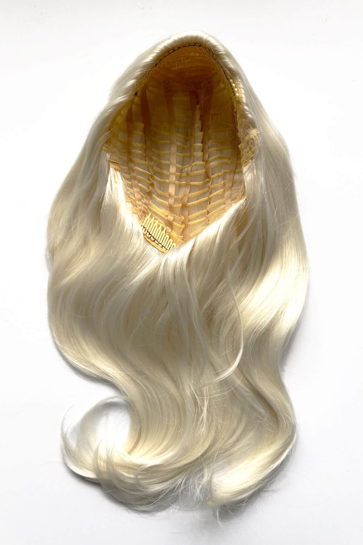 Blonde hair extension on a white background. Half wig hairpiece, long and wavy, Flexihair (Heat styleable) and volume ring for high crown: Sharon platinum blonde 1001
