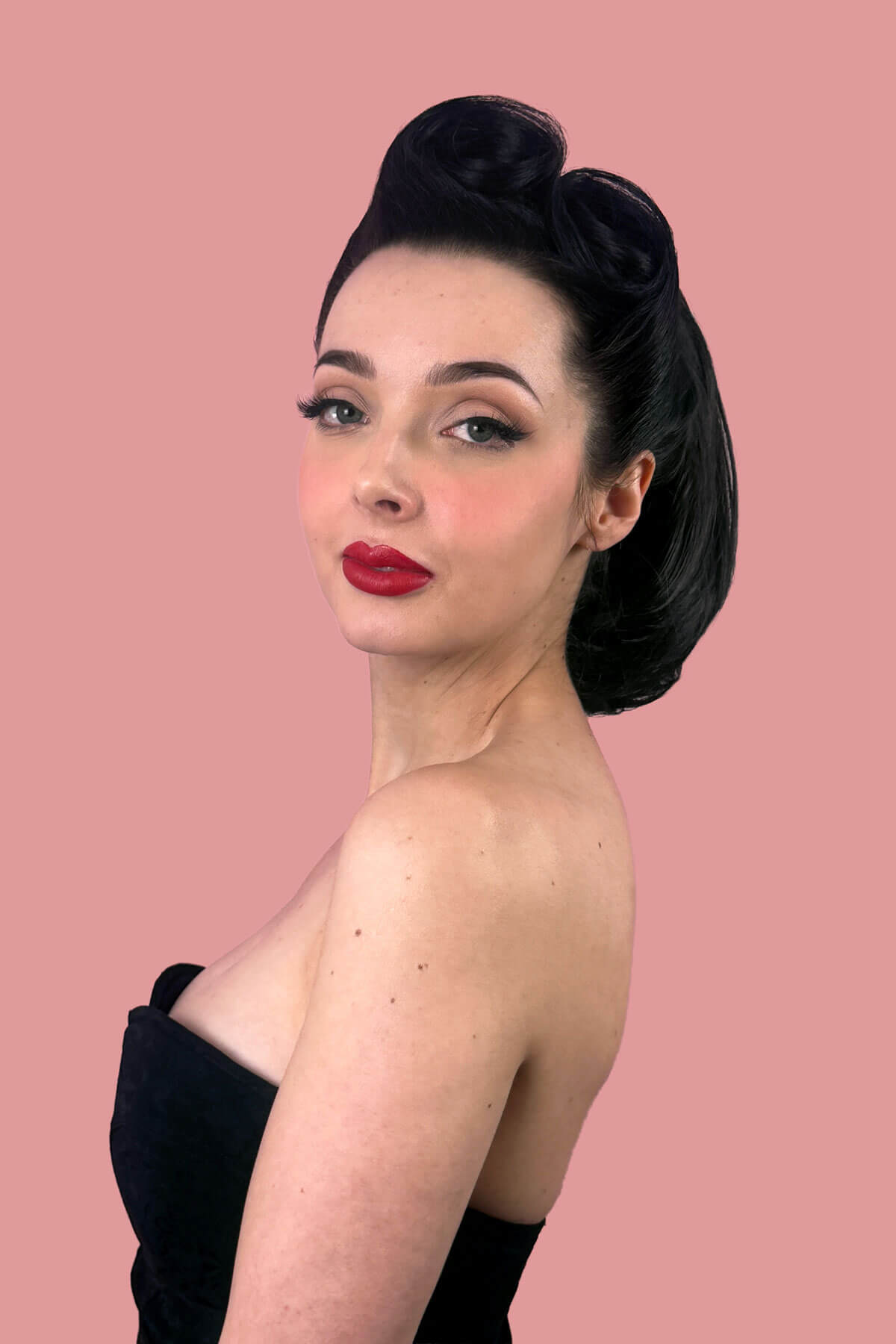 Woman with short ponytail extension hairpiece, straight, full & bouncy: Tanaya black 1B