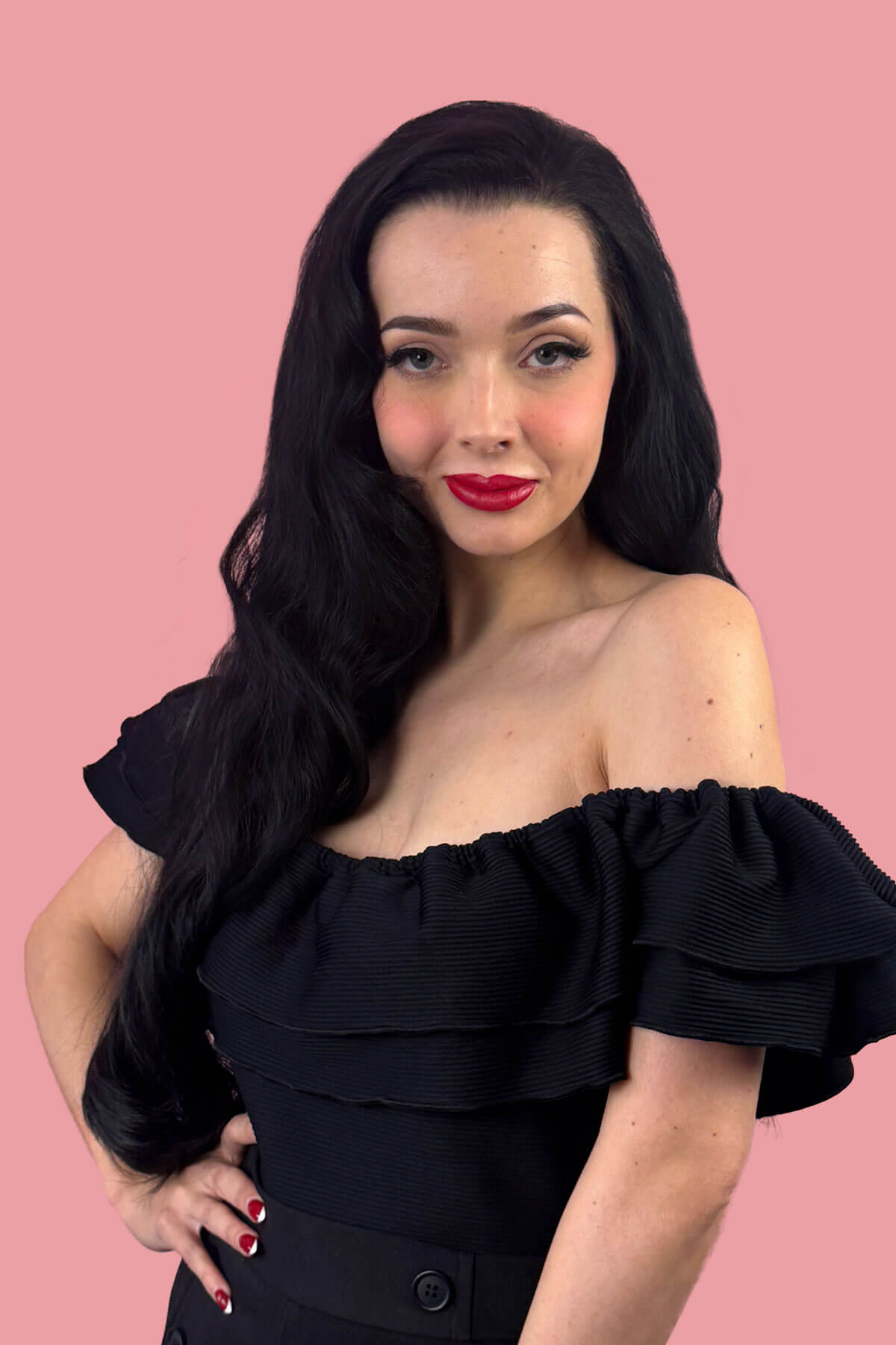 Woman with long black hair wearing a black dress against a pink background. Heat styleable half wig hairpiece (3/4 wig), long wavy, Flexihair: Kate black 1B