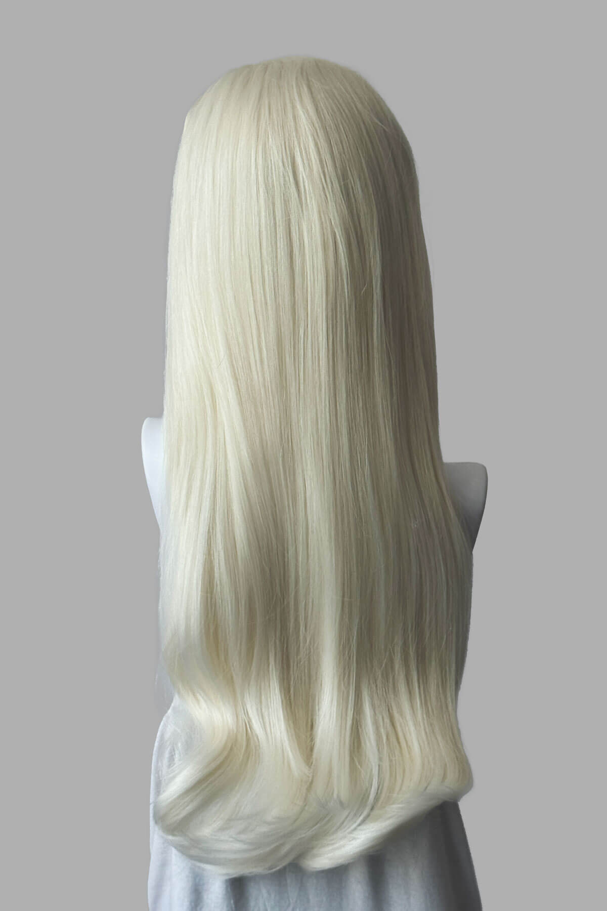 Long, platinum blonde half wig on a plain background. Kate - Heat Styleable Extra Long, Gentle Wave Half Wig dark platinum blonde 1001