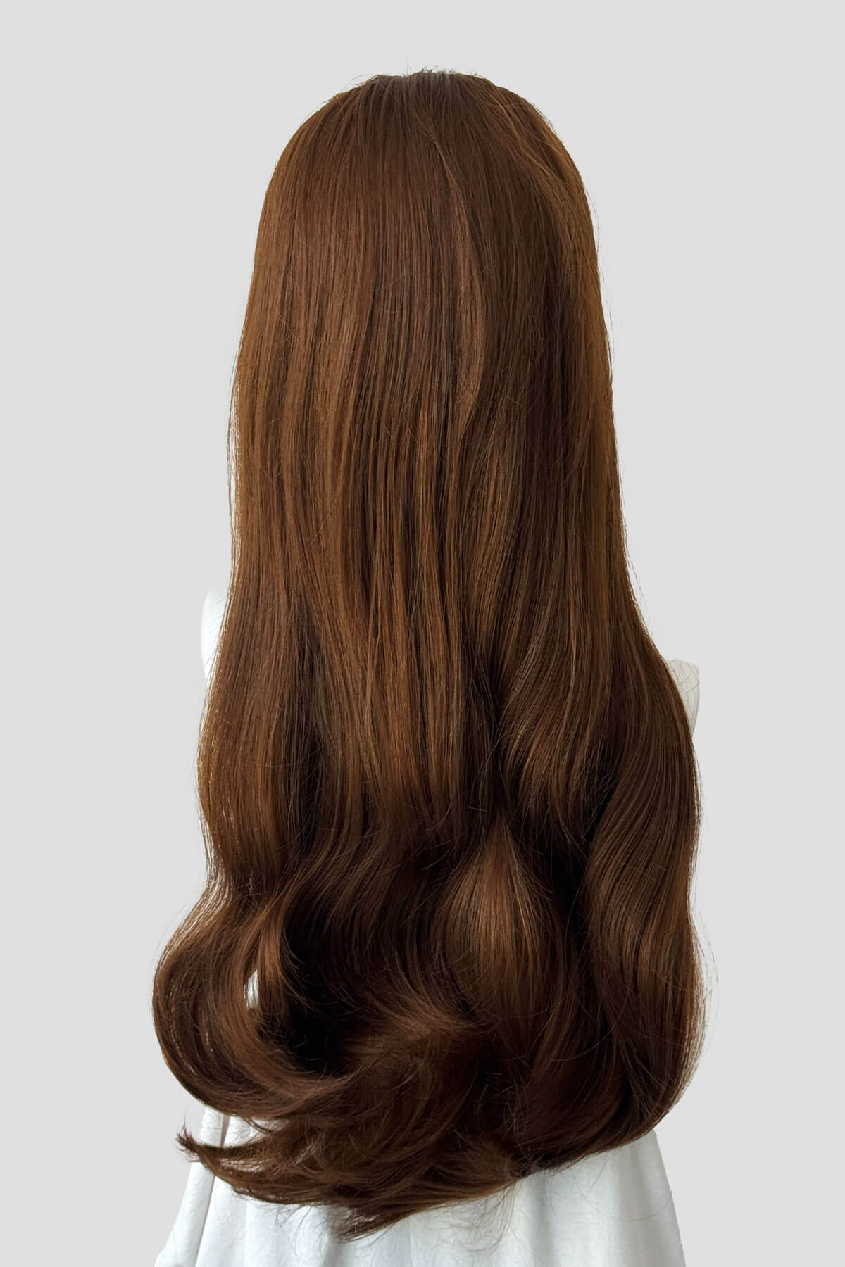 Long, light brown wig on a plain background. Kate - Heat Styleable Extra Long, Gentle Wave Half Wig dark light brown 12