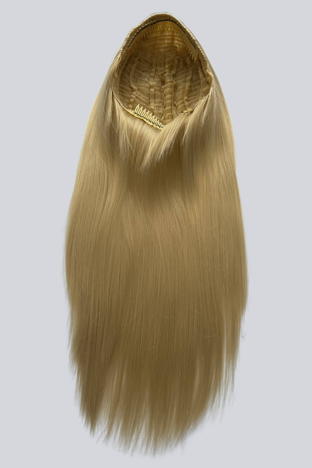 Blonde hair extension on a white background. 1960s style hair, high crown long straight half wig: Andrea champagne blonde 613