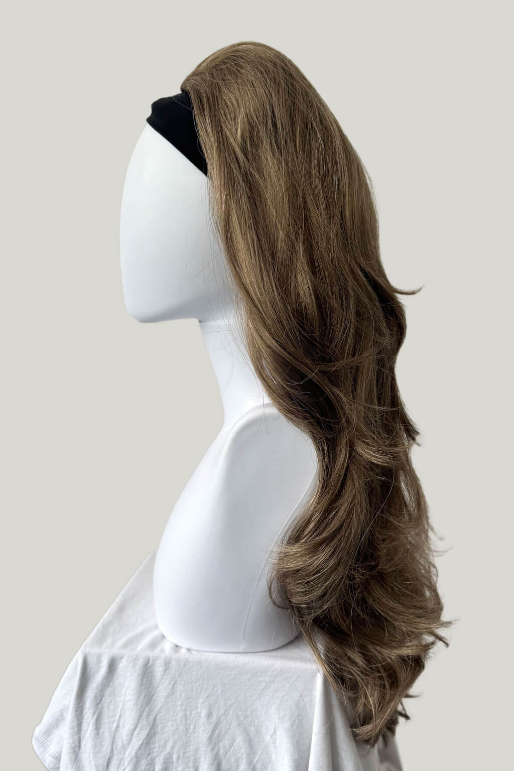 Long brown ponytail on a mannequin head against a plain background - High crown long, layered half wig and volume ring: Helena mocha brown and blonde 10/16