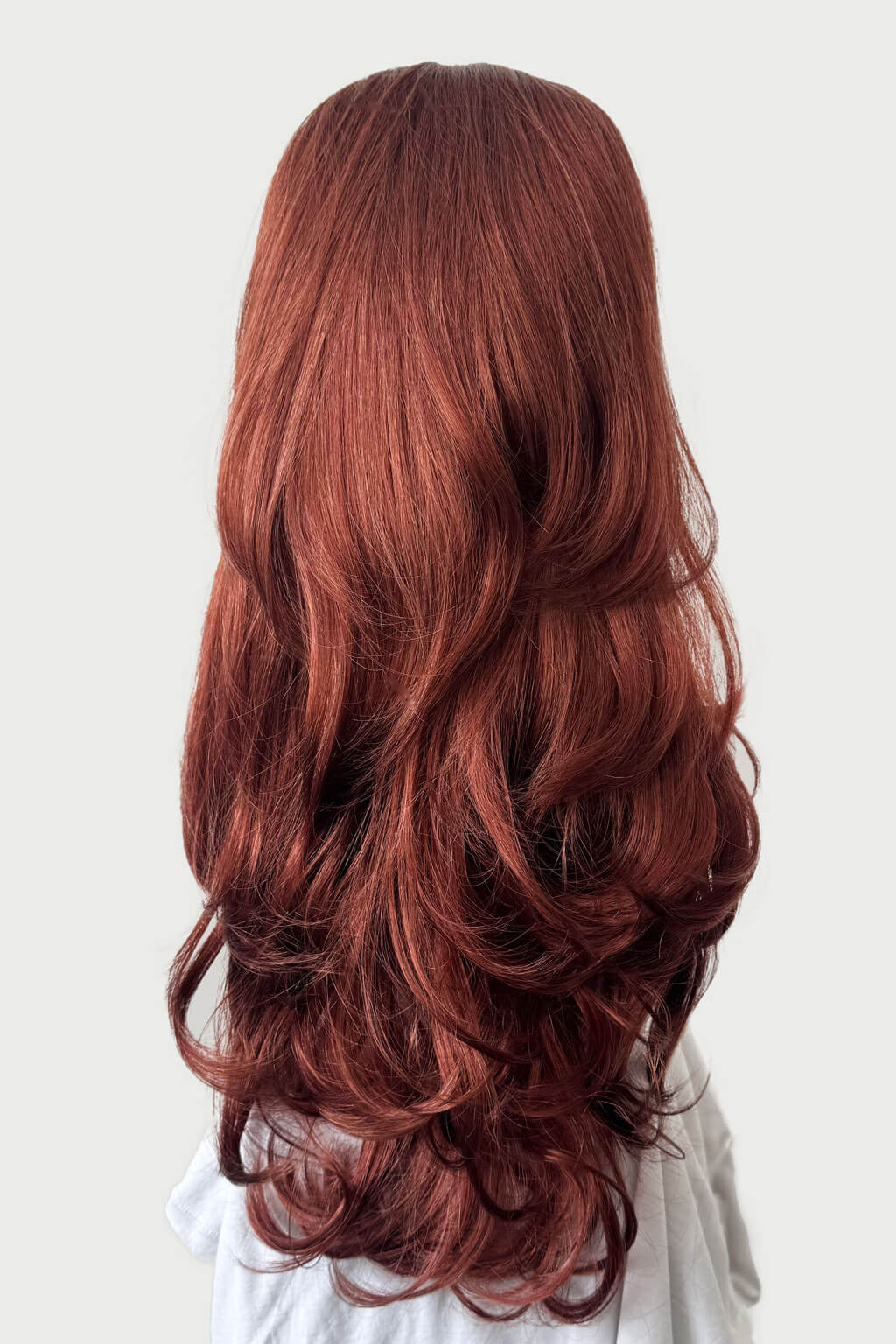Long, wavy red hair on a white background - High crown long layered half wig and volume ring Helena copper red 130