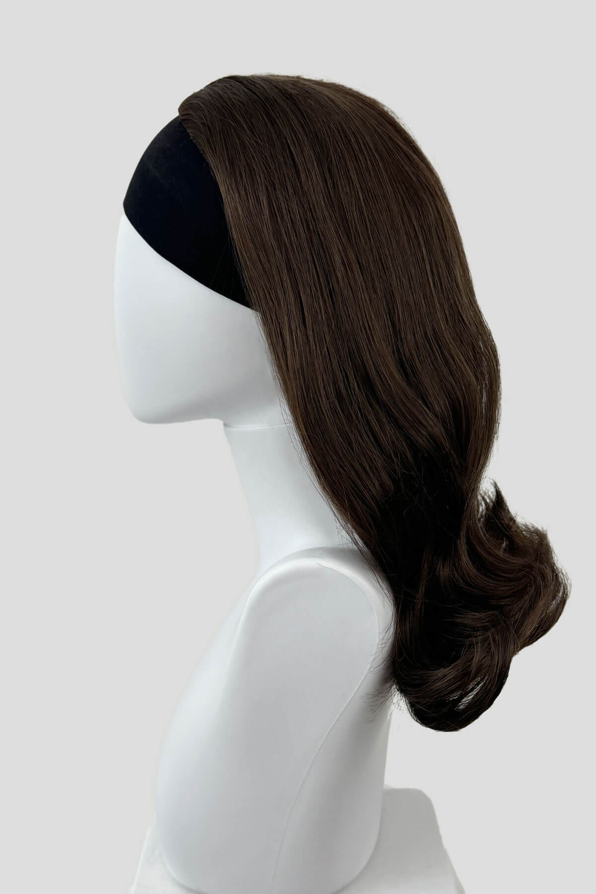 Brown wig on a mannequin head against a white background. 1960s half wig hairpiece, flicked, hair flip: Philippa chestnut brown 8