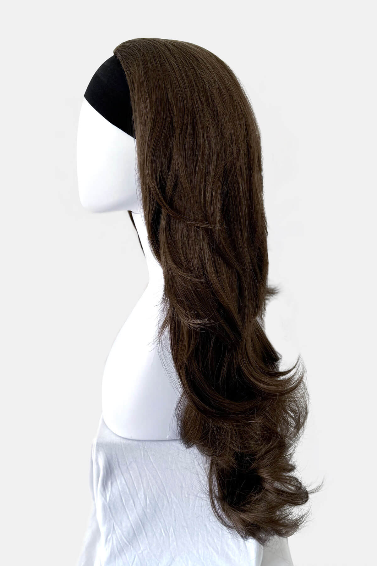 Brown wig on a mannequin head against a white background. Brown half wig hairpiece (3/4 wig), layered, wavy: Simone mocha brown 10