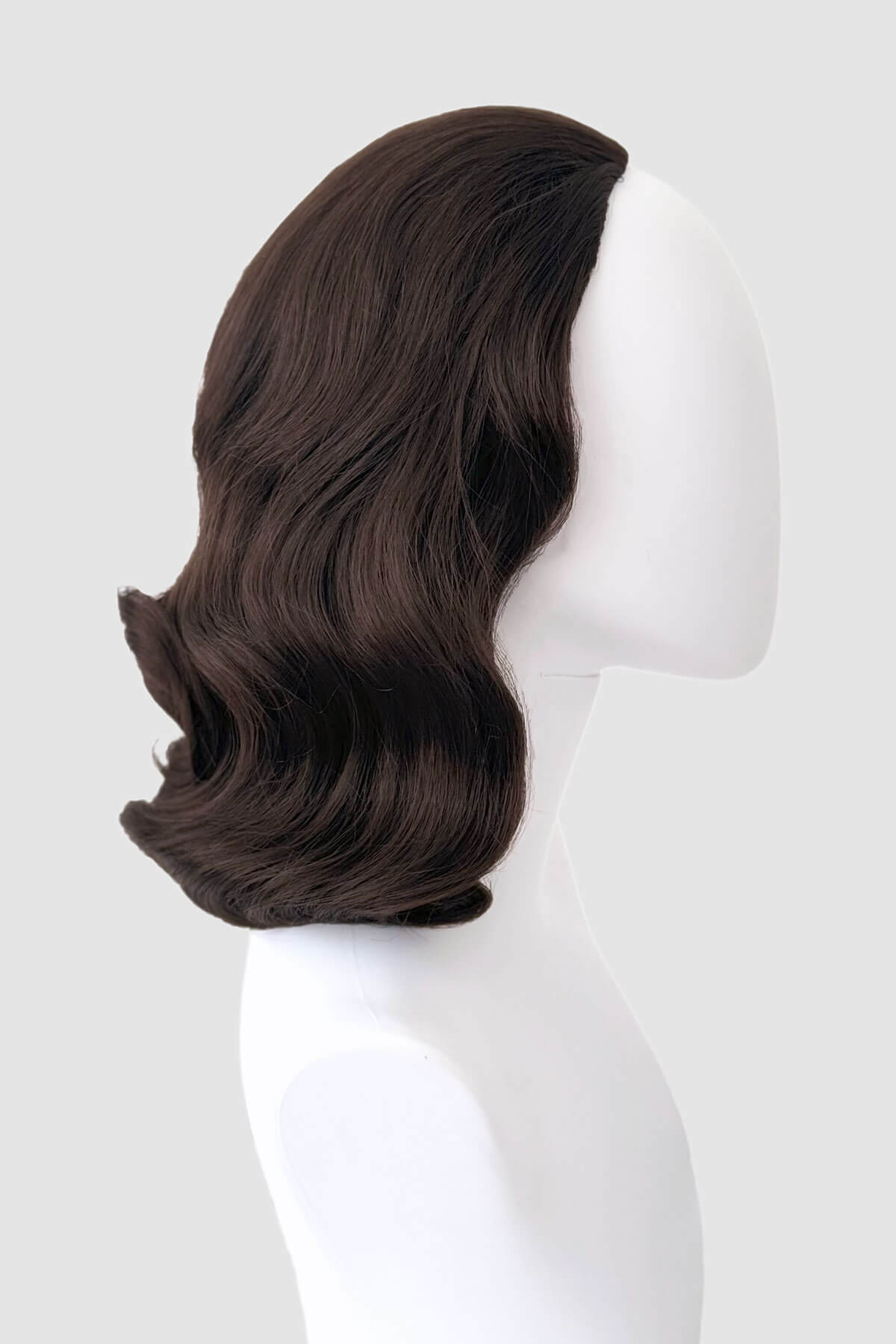 Brown wig on a mannequin head against a white background. 1940s style half wig hairpiece with beautiful marcel waves: Virginia dark brown 6