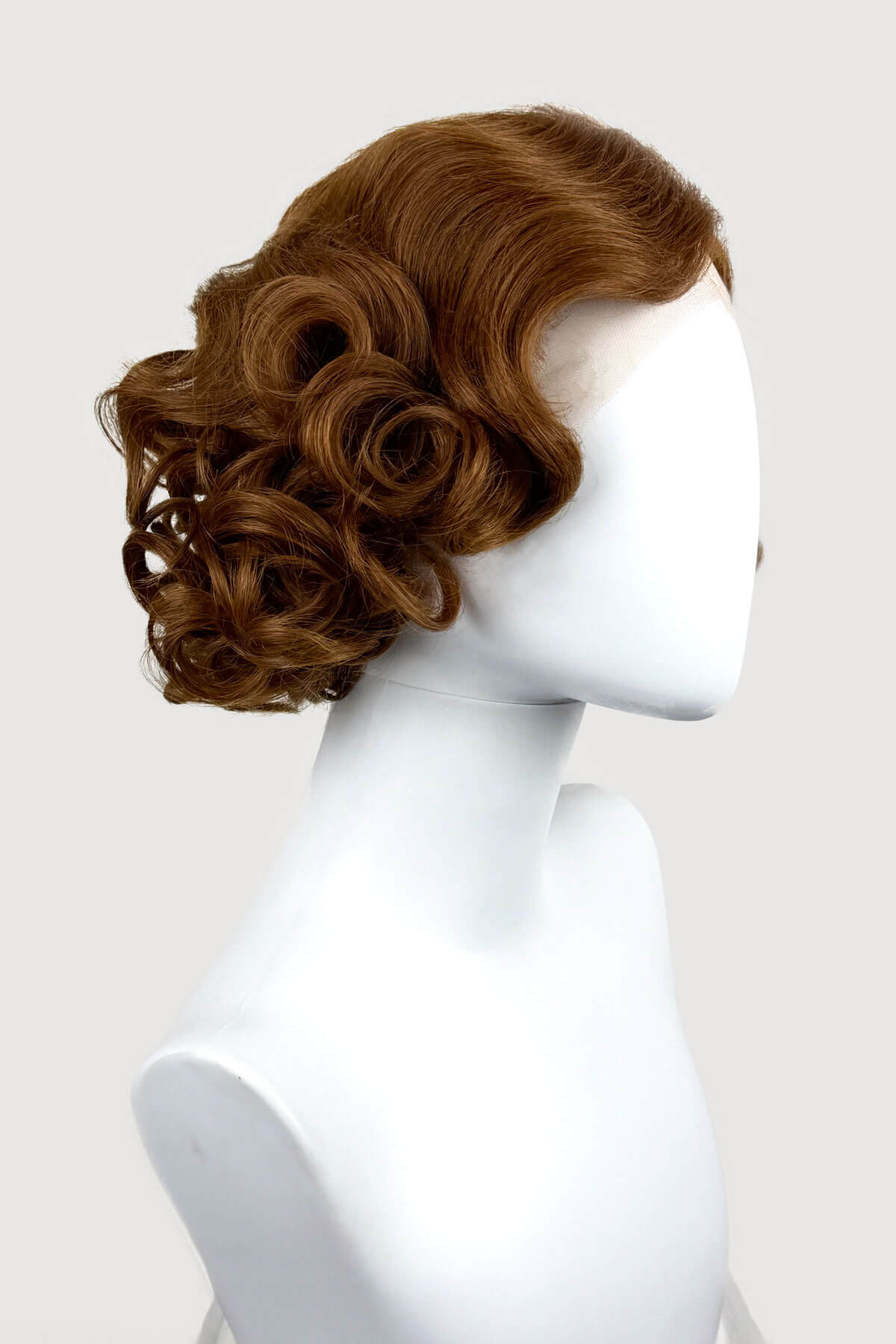 Auburn brown wavy wig on a mannequin head against a white background. Auburn pinup wig, lace front, vintage style: Tawney