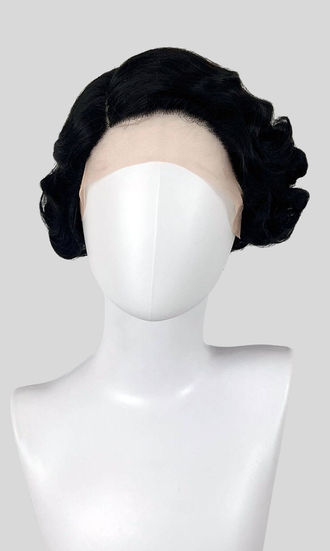 Black hairpiece styled on a mannequin head against a white background. Black lacefront wig, pinup/vintage style, short with finger waves: Viola
