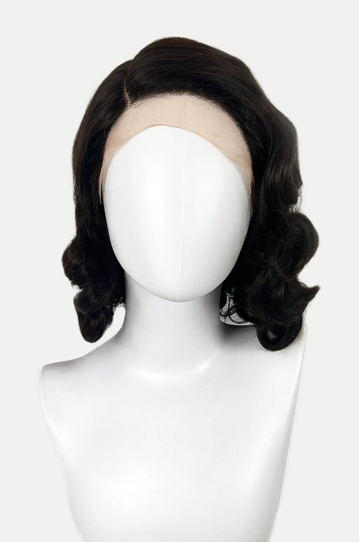 Black wig on a mannequin head against a white background. Brown lacefront wig, pinup/vintage style, mid length with finger waves: Hattie