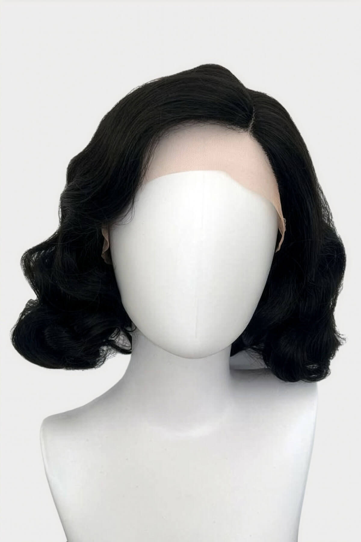 Black wig on a mannequin head against a white background pictured from front. Black lacefront wig, pinup/vintage style, mid length with finger waves: Lilith black 1B gothic