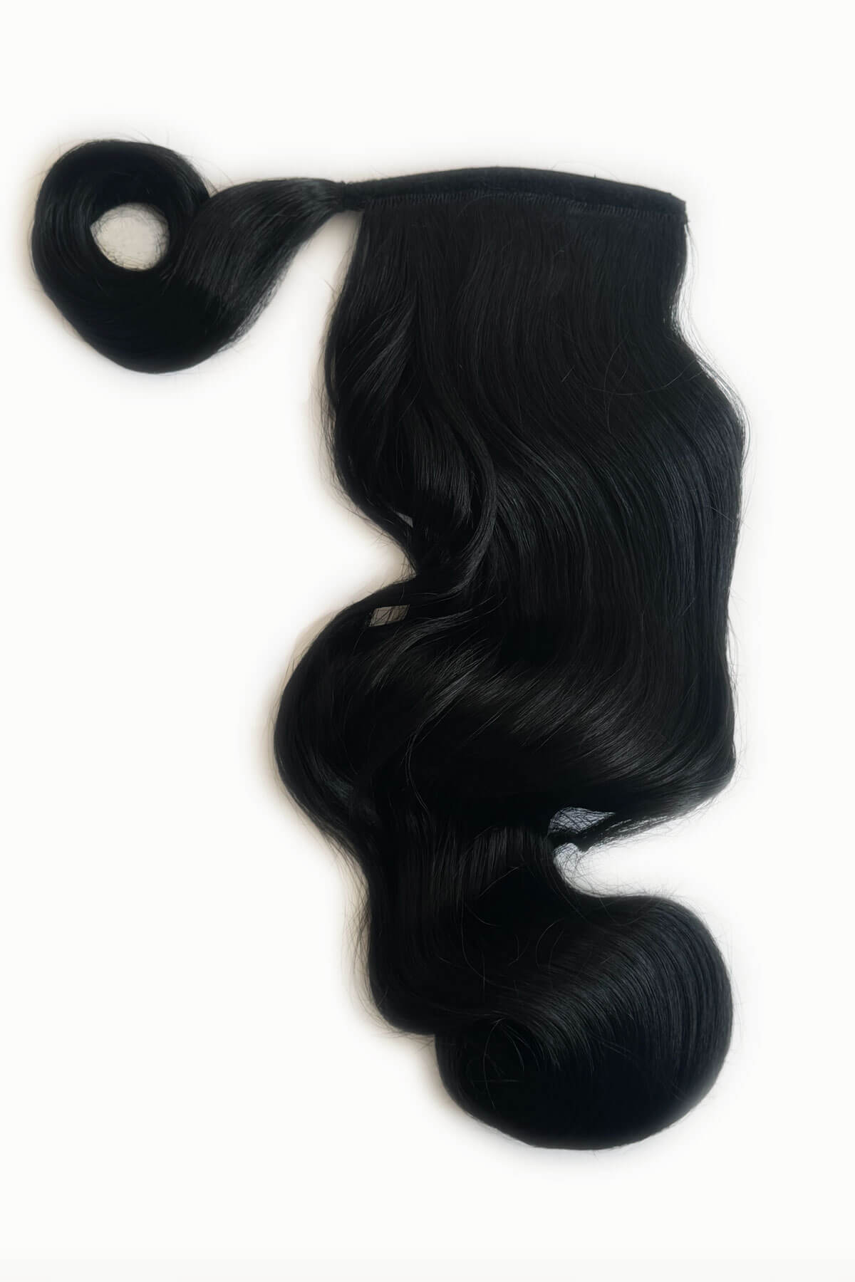 Black hair piece on a white background. Long ponytail with vintage waves: Kitrysha jet black 1
