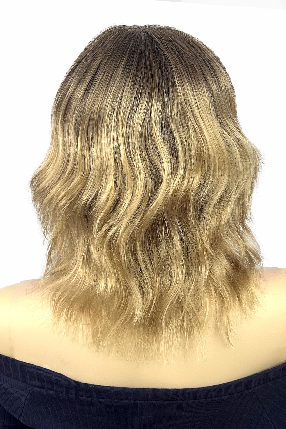Blonde wavy hair on a white background. Long bob wig (LOB) with textured waves, blended from chestnut brown to blonde: Lili