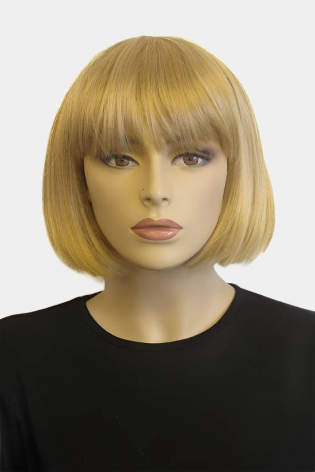 Mannequin head with a blonde bob wig on a white background. Blonde bob wig with fringe: Gracie blonde 24B