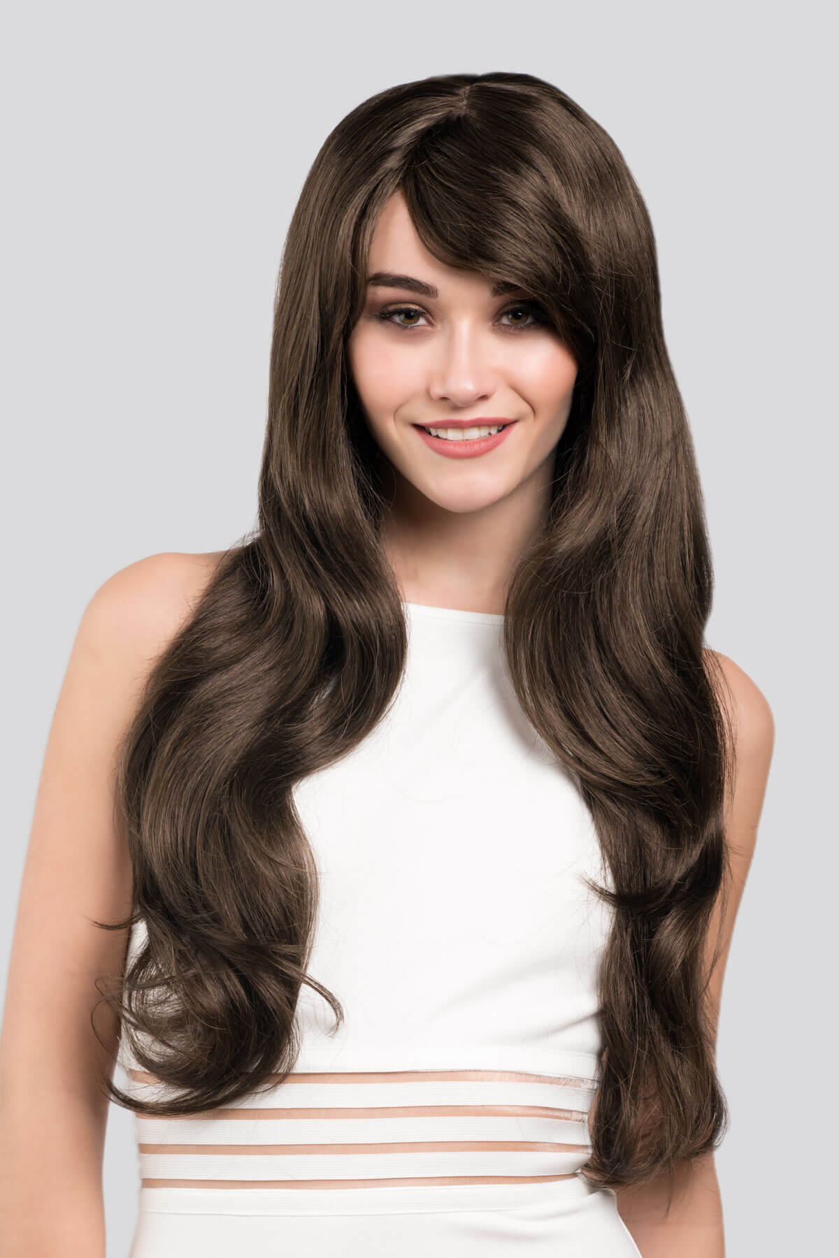 Woman with long brown wig on a plain background. Long brown wig with loose waves: Mandy chestnut brown 8