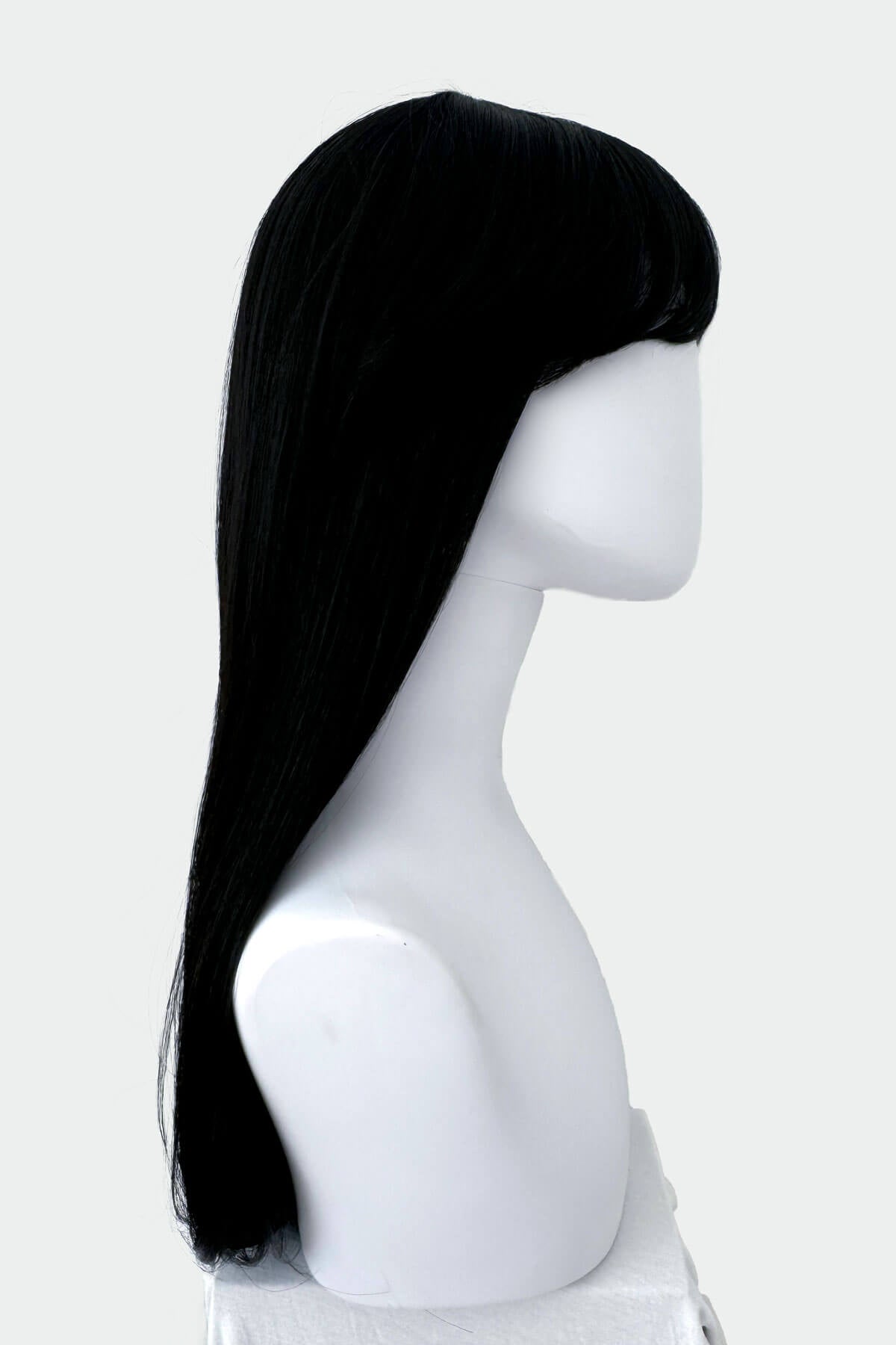 Black wig on a mannequin head against a white background. Long straight black wig with straight fringe: Carmen