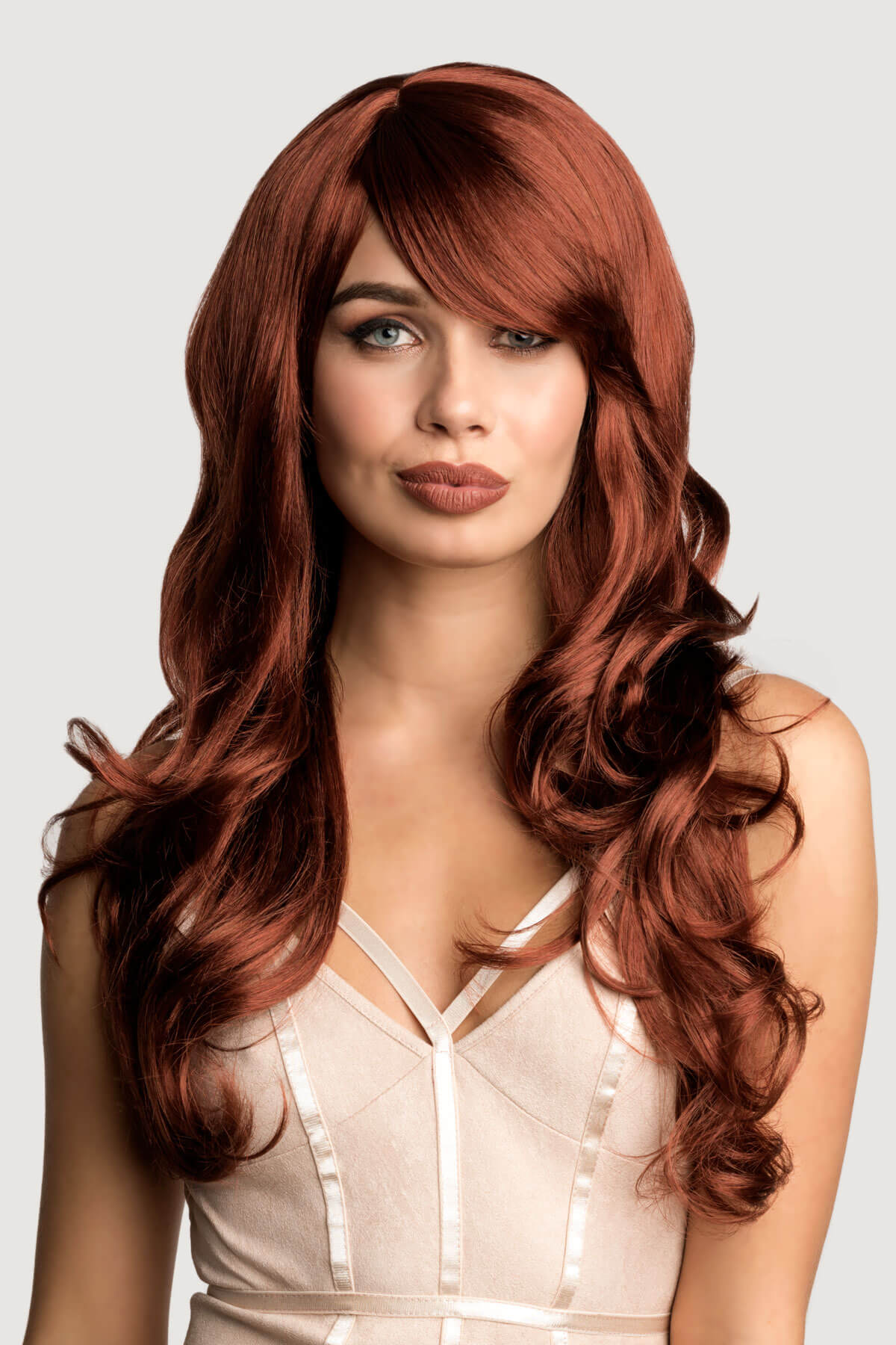 Woman with long, wavy red hair against a light gray background. Long copper red wig with gentle waves: Kelly