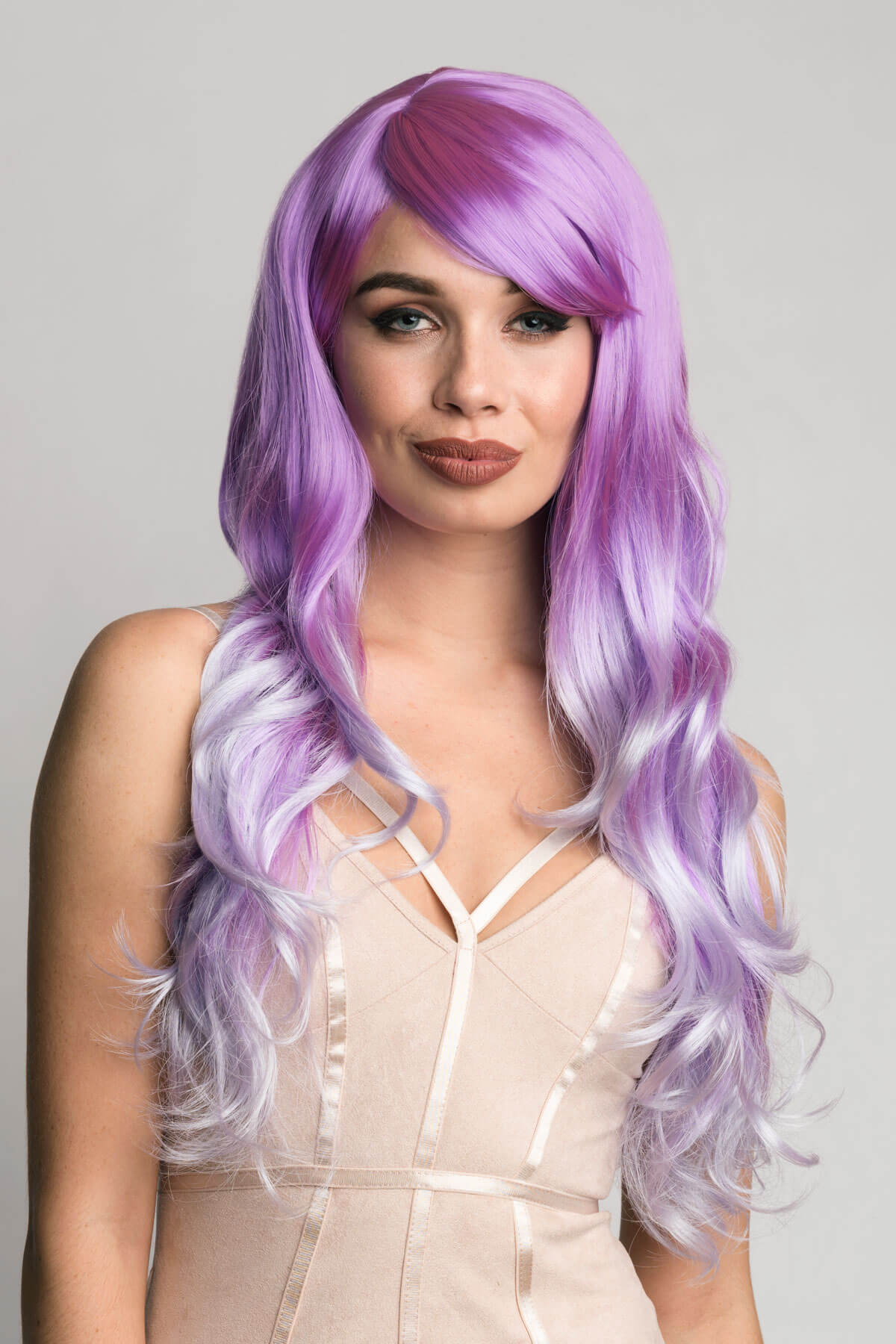 Woman with long purple wig on a gray background. Long purple and grey wig: Raspberry