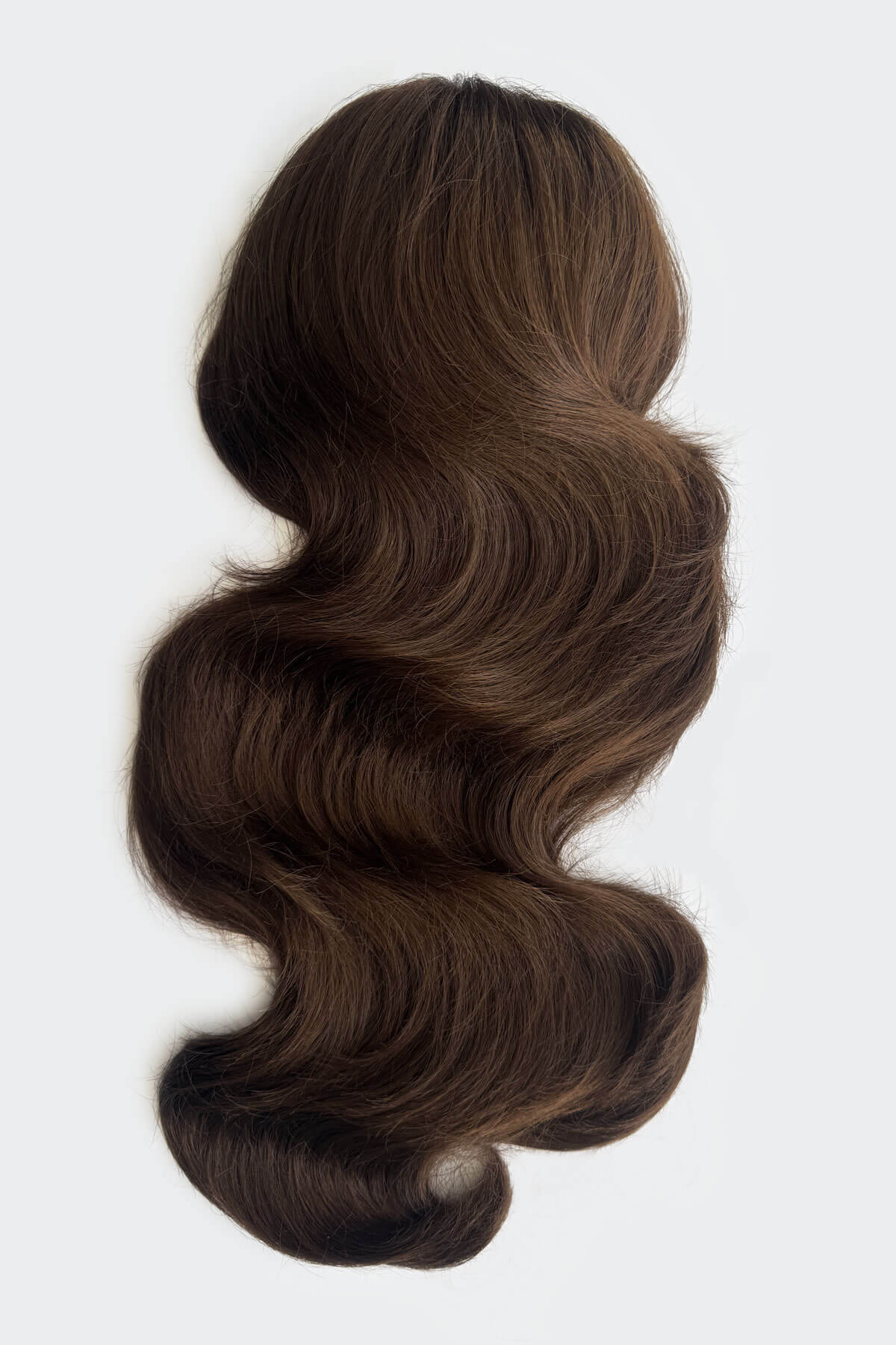 Brown hair extension on a light grey background. Double volume hairpiece extension: Naomi chestnut brown 8