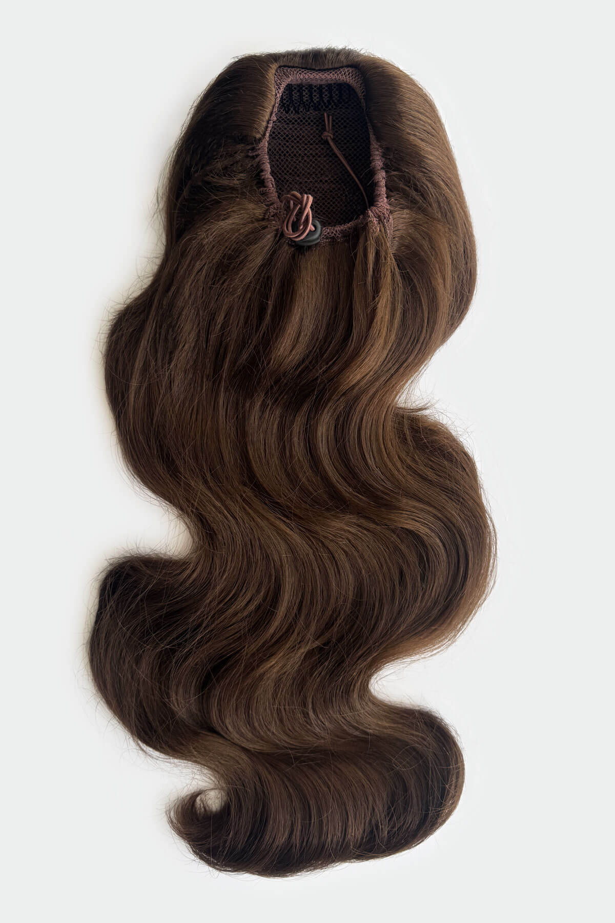 Brown hair extension with a draw string attachment on a light grey background. Double volume hairpiece extension: Naomi chestnut brown 8