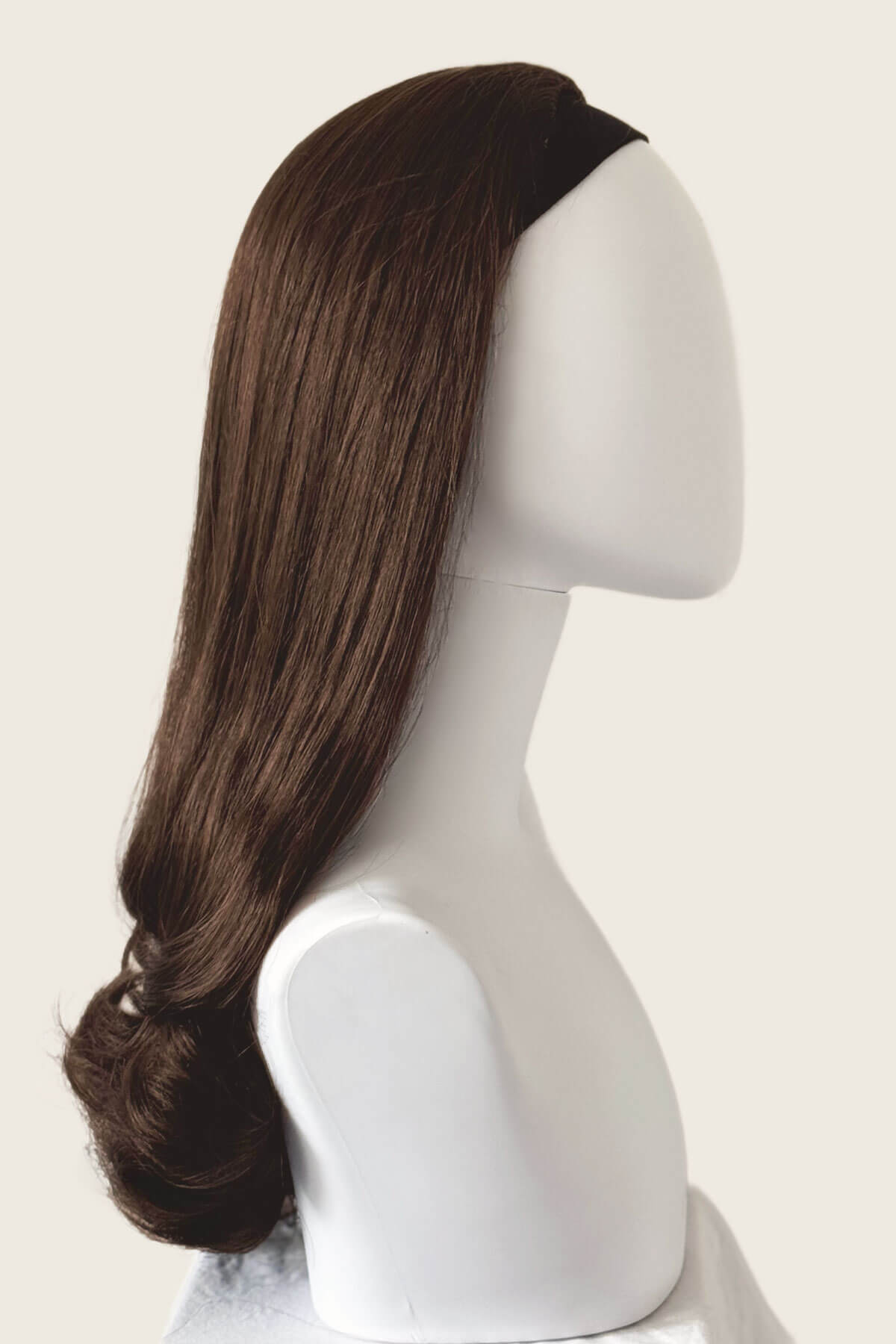 Brown wig on a mannequin head against a white background. 1960s Retro high crown, half wig hairpiece, long with hair flip: Priscilla chestnut brown 8