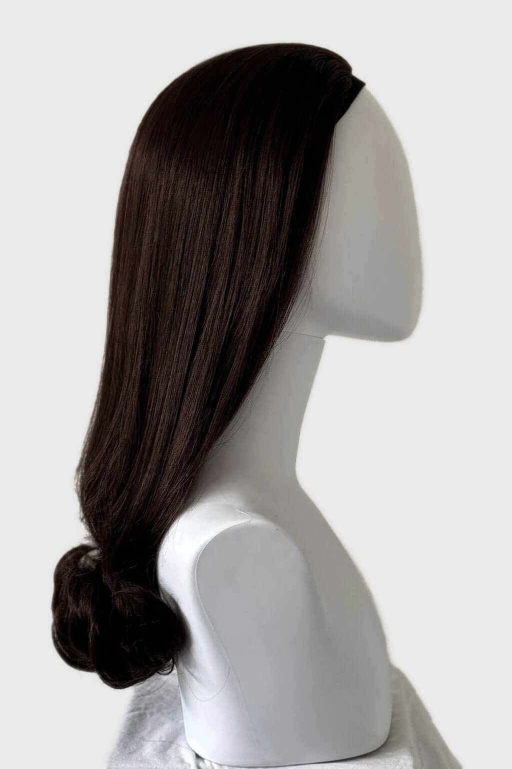 Dark brown wig on a mannequin head against a white background. 1960s Retro high crown, half wig hairpiece, long with hair flip: Priscilla chocolate brown 6