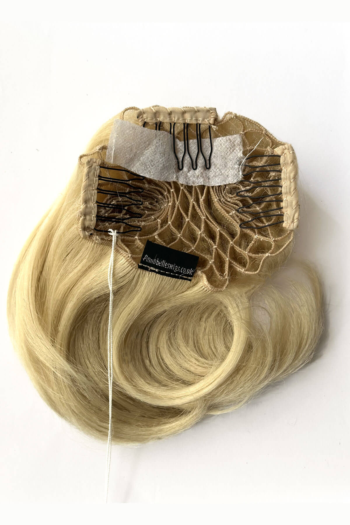 Blonde hair extensions with a clip-in design on a white background. Beehive hairpiece hair height booster, Flexihair: Pixi creamy blonde 613