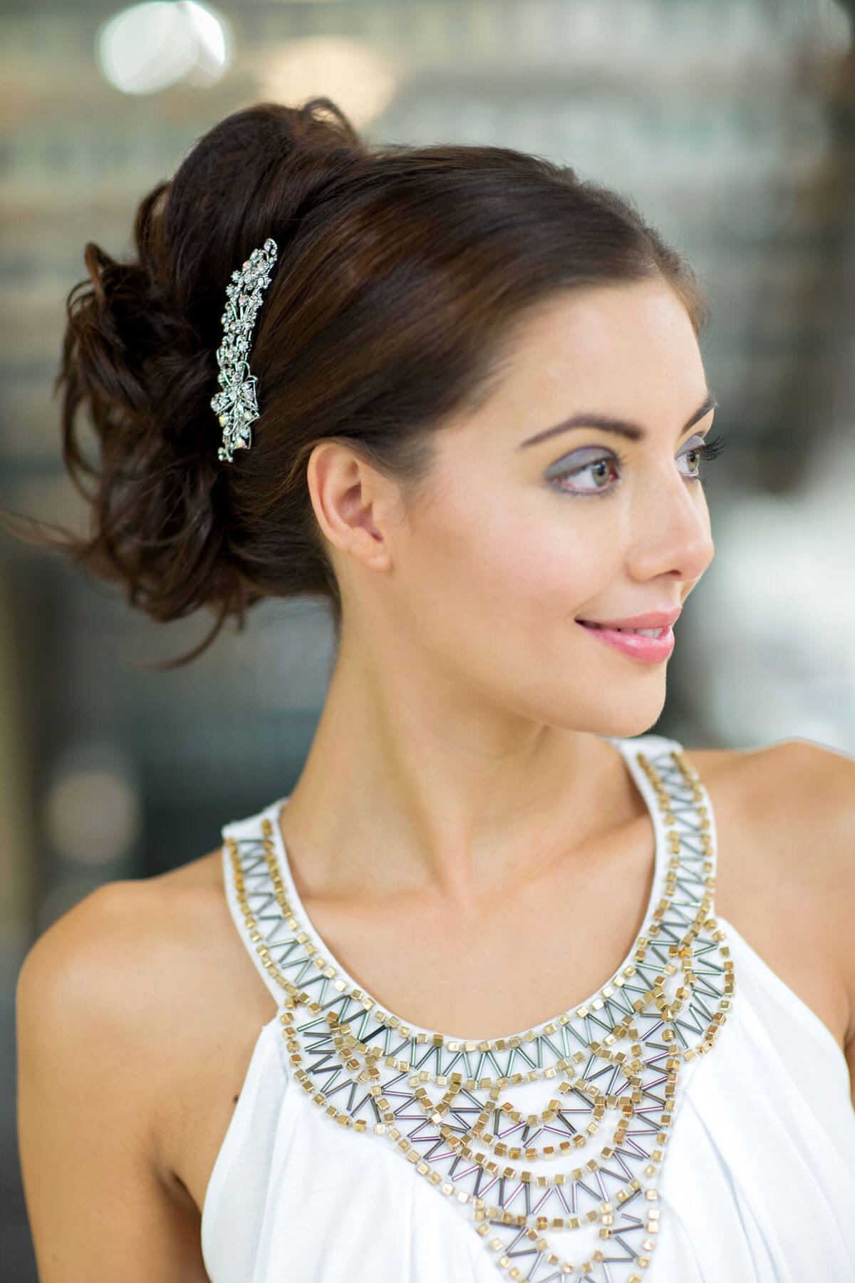 Woman with elegant hairpiece and white dress with intricate neckline. Clip in hairpiece, ponytail, short, flexihair: Leela chestnut brown 8