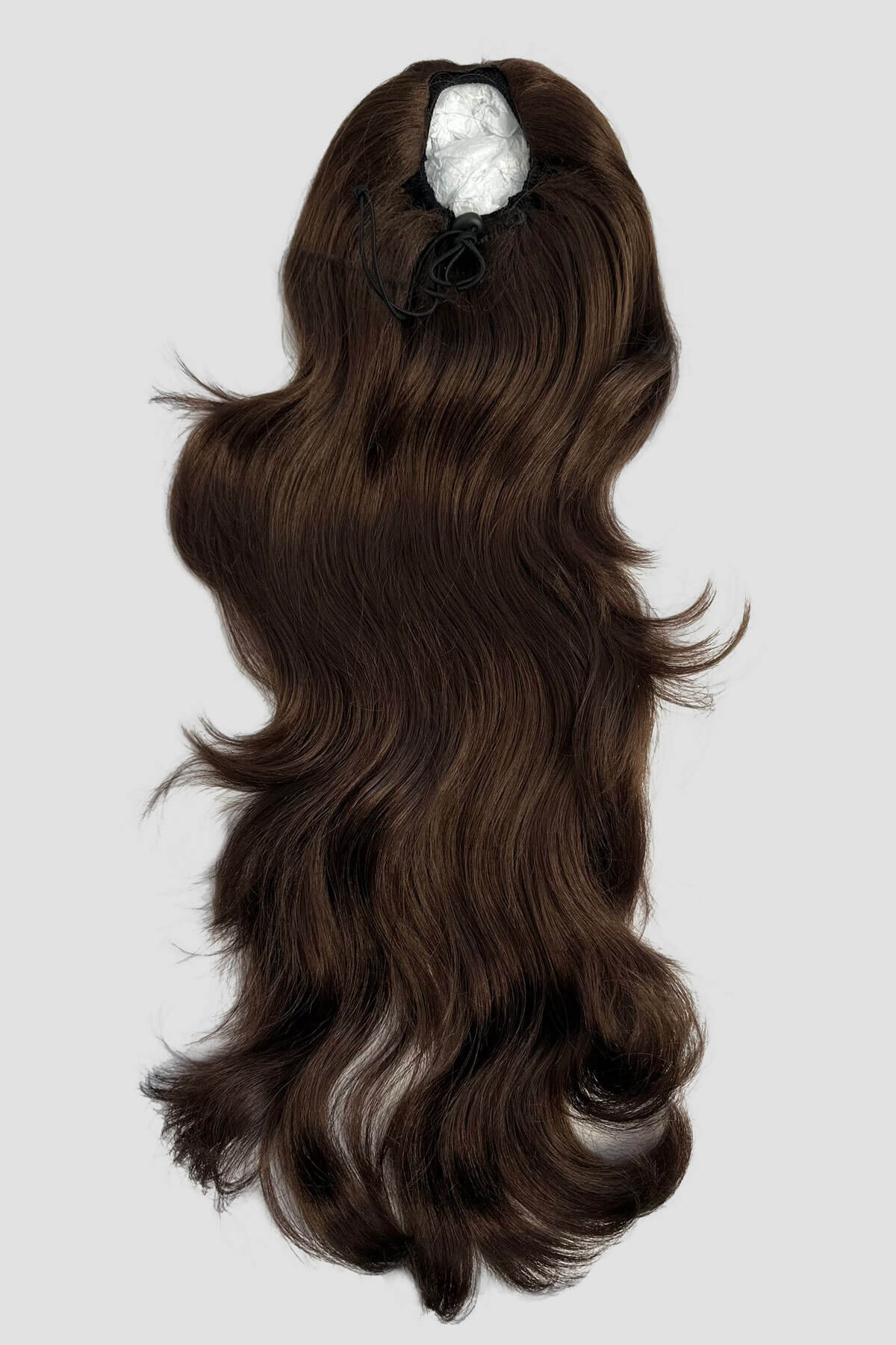 Brown hair extension with a clip on a light gray background. Double volume hairpiece extension: Naomi chestnut brown 8