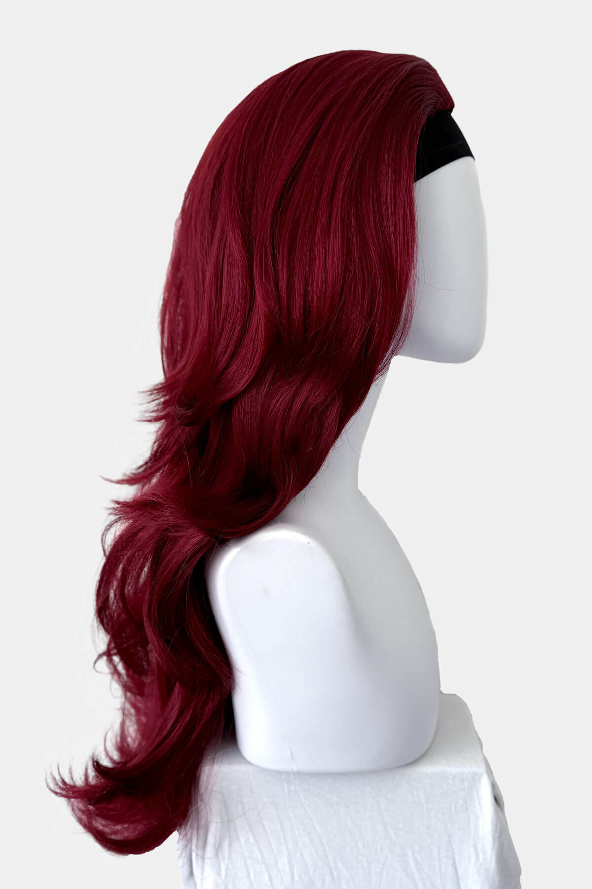 Red wig on a mannequin head against a white background.  Red half wig hairpiece (3/4 wig), gentle curls: Ivy wine red 39
