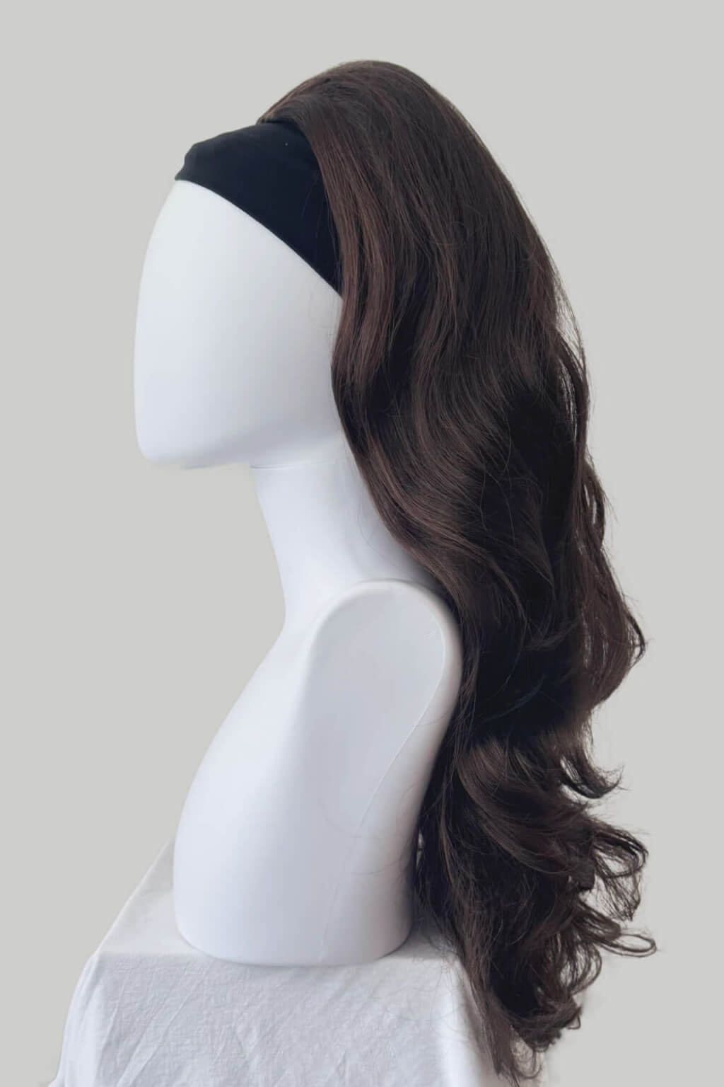 A long, wavy dark brown wig displayed on a white mannequin head and shoulders. High crown long, wavy half wig and volume ring: Bardot reddish brown 6-33