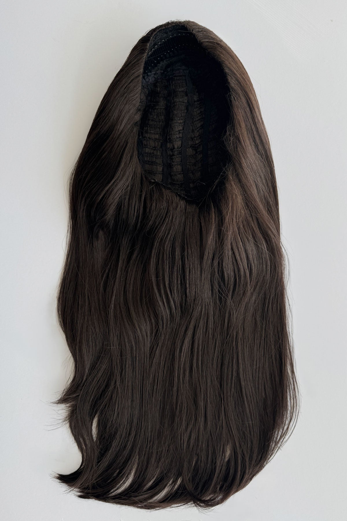 A long, wavy dark brown wig with a black mesh interior, shown against a plain light grey background. Claudia - Volume Boosting Long Gentle Bouncy Layered Half wig dark brown 4