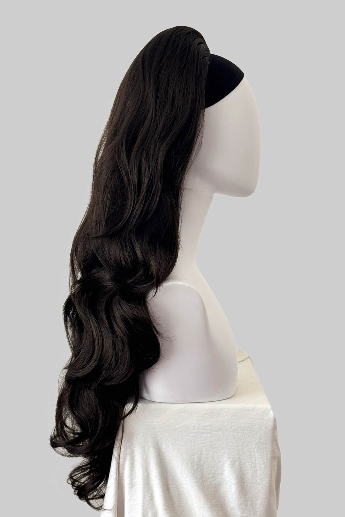 Dark brown half wig on a mannequin. Corrine - Bouncy Blowout style with Volume Booster Half Wig dark brown 4