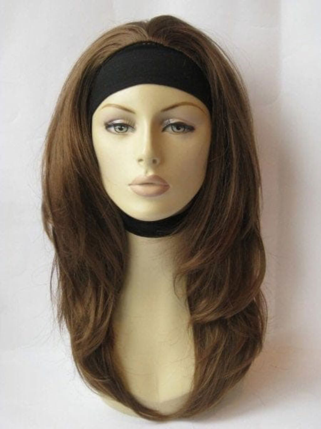 Mannequin head with brown wig and black headband on a white background. Brown half wig hairpiece gently layered: Briar light brown 12