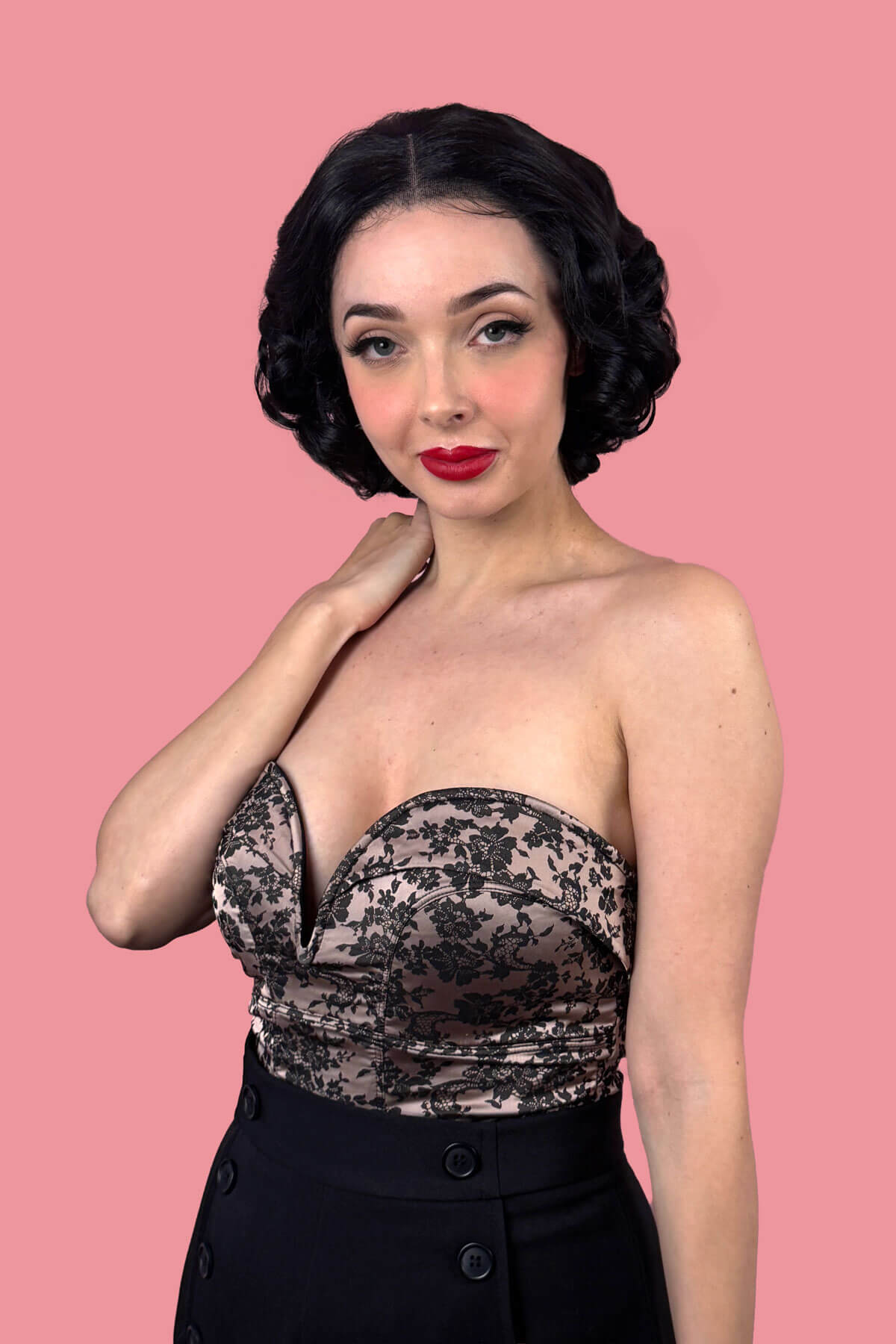 Woman with short black waved hair. Black pinup wig, lace front, vintage style: Halle