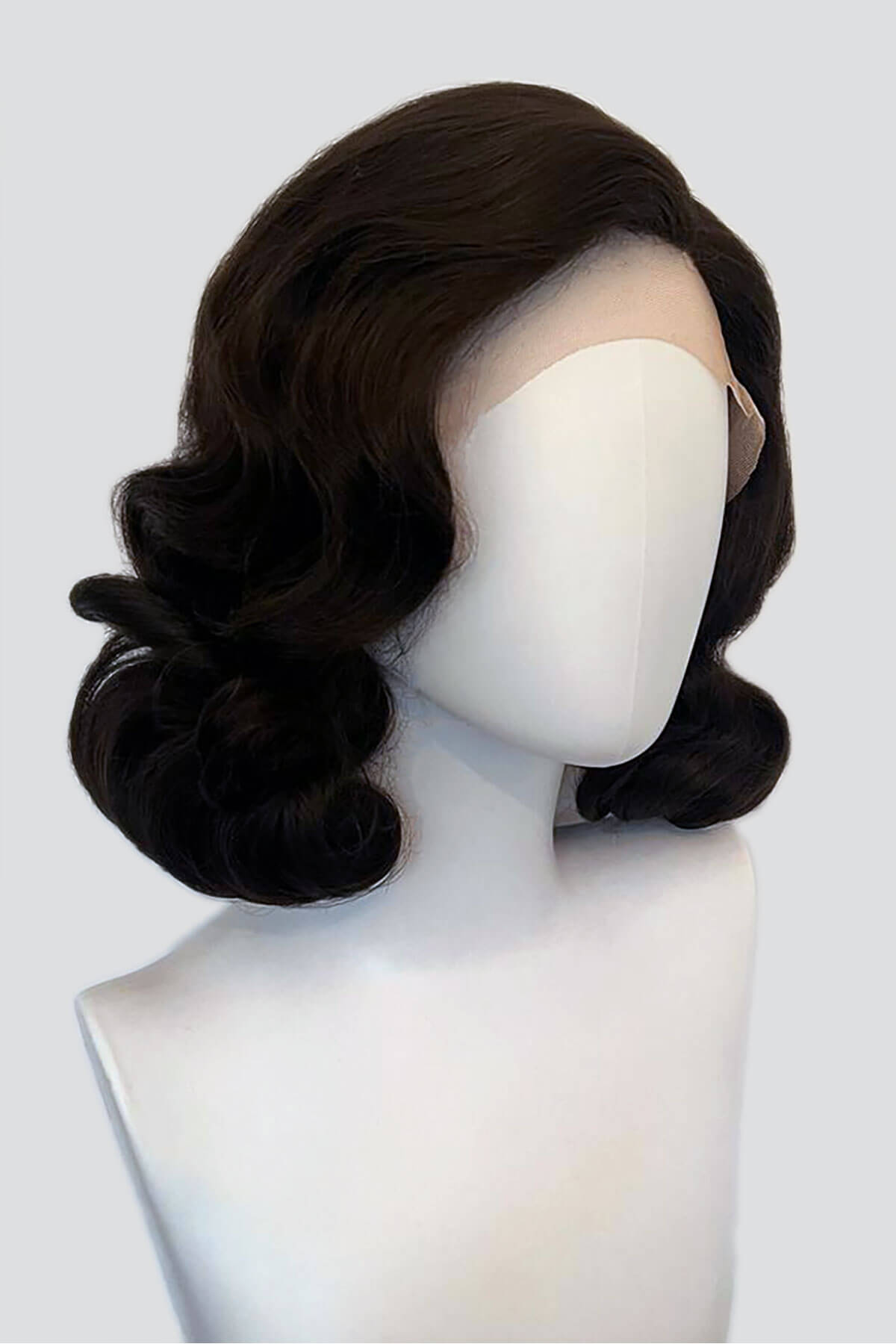 Black wig on a mannequin head against a white background. Brown lacefront wig, pinup/vintage style, mid length with finger waves: Agatha