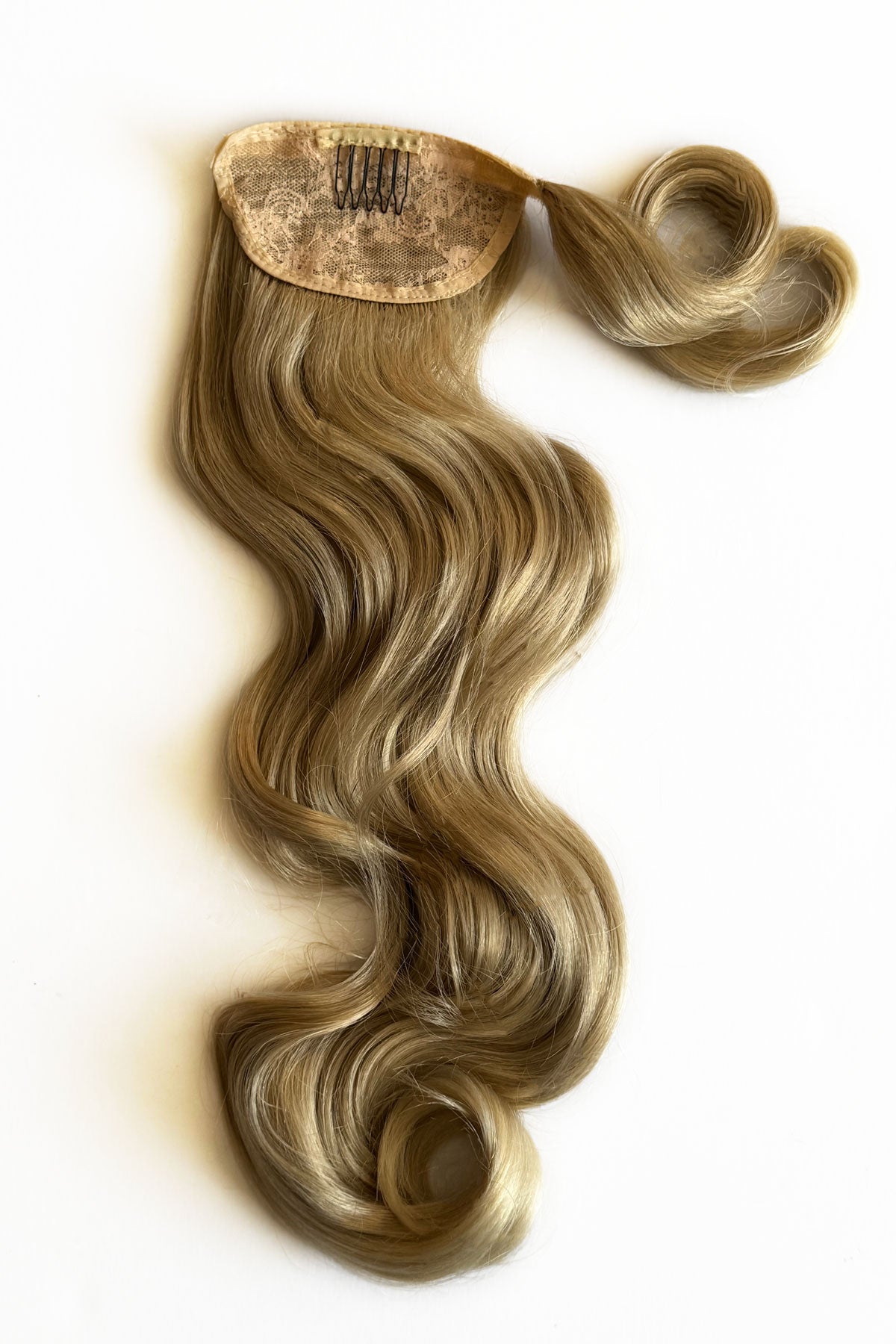 Blonde hair extension with a clip on a white background. Long ponytail hairpiece with vintage waves: Kitrysha - blonde 613T24