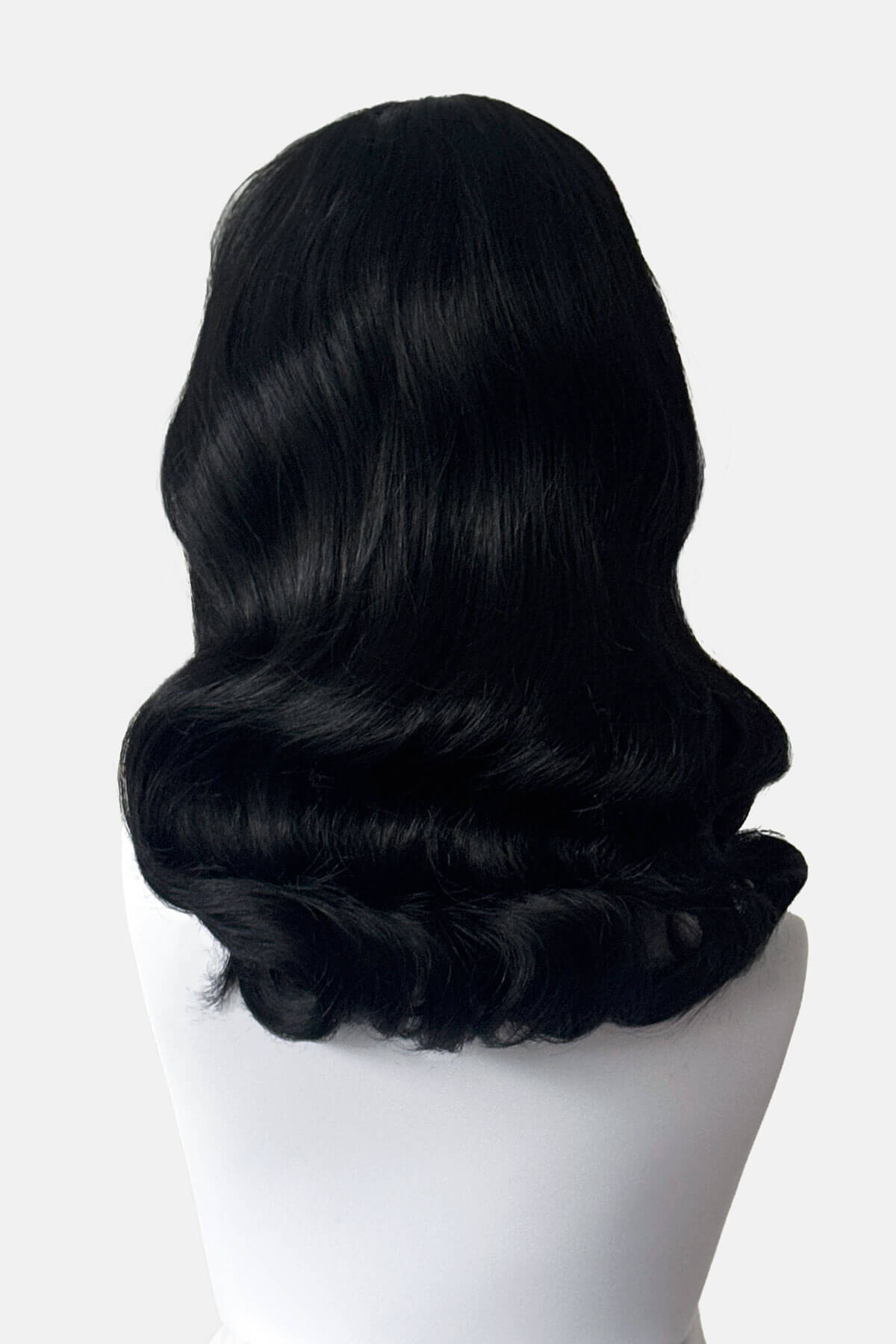 Mannequin with shoulder length, black wavy wig. Black pin-up style wig, curled with short fringe: Bettie