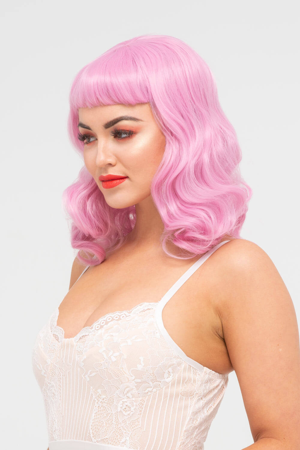 Pink pinup style wig, with finger waves and a short fringe, 1950s style: Stevie 2614J
