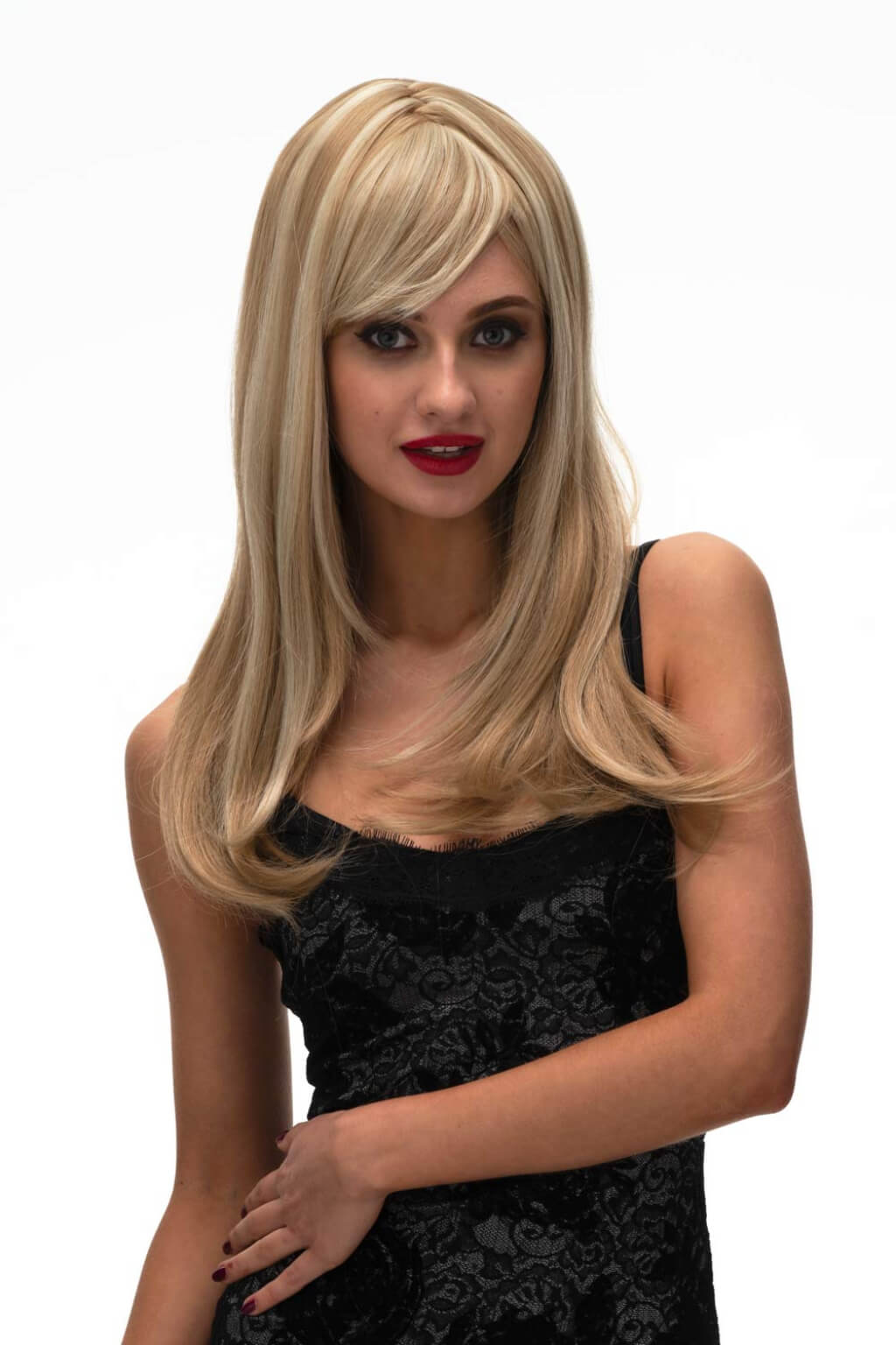 Woman wearing a blonde wig on a white background. Long blonde wig, face framing with long, side-sweeping fringe: Ashley